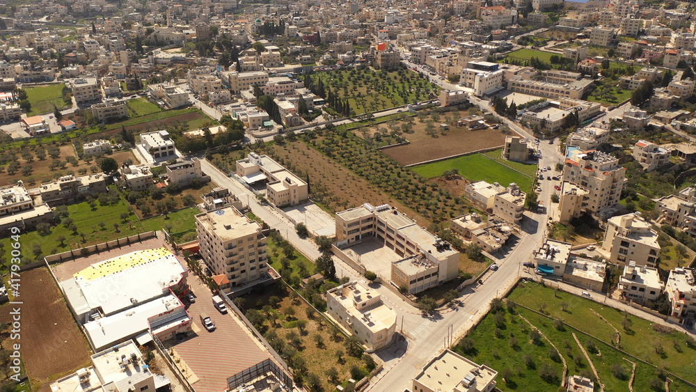 Aerial view over Bethlehem City, Palestinian Authority
Drone view over buildings and fields in the morning, March 2021
