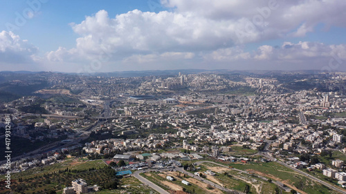 Jerusalem City wide aerial Flight view Drone high altitude view of Jerusalem,clouds and Blue skies March 2021 Israel 