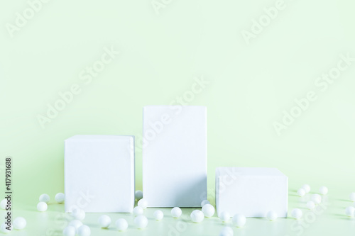 White empty podium stands on light color background.