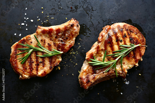 Canvas Print Grilled pork loin on a bone. Top view with copy space.