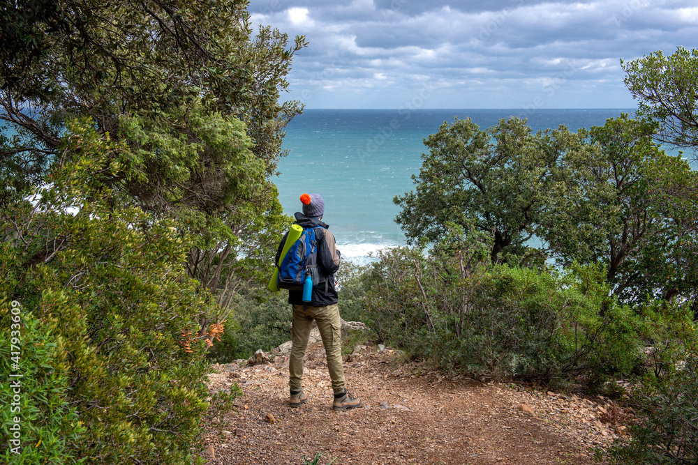 young man does trekking and hiking in a coastal forest of Sardinia, Italy
hiker with backpacks in the forest, nature walks
