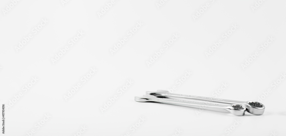 Wrench on a white background. Combined open-end wrench for taps. Plumbing tool. Wrench on a white background. Combined open-end wrench for taps. Plumbing tool.