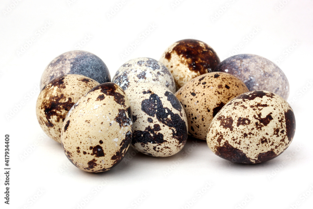 bunch of quail eggs on a white background (not isolated). bunch of quail eggs on a white background (not isolated).