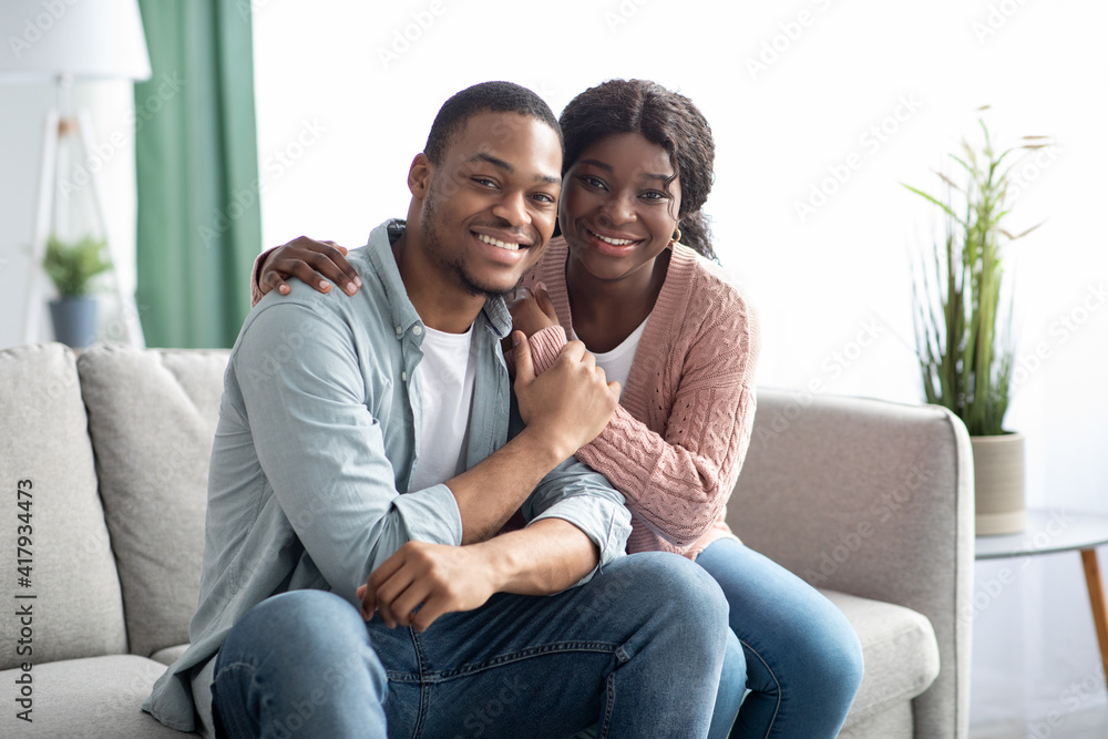 Beautiful black couple spending time together at home Beautiful black couple spending time together at home