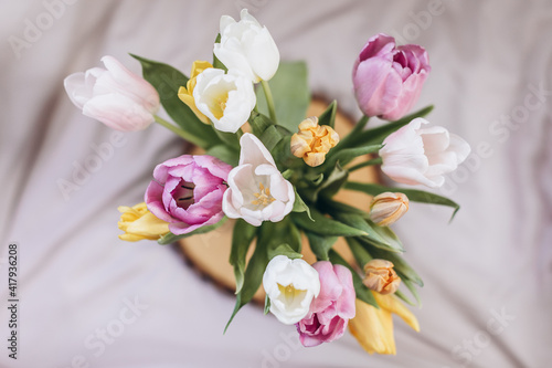 bouquet of pink tulips on wooden table © Svetlana