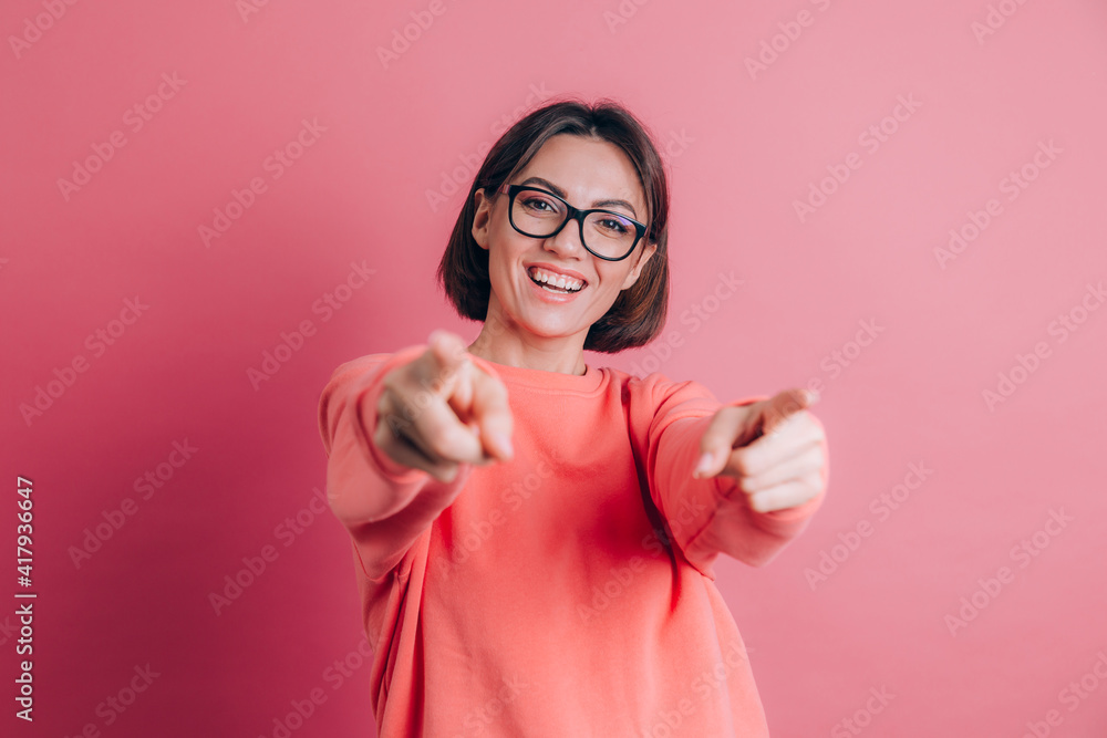 Woman wearing casual sweater on background pointing to you and the camera with fingers, smiling positive and cheerful Woman wearing casual sweater on background pointing to you and the camera with fingers, smiling positive and cheerful