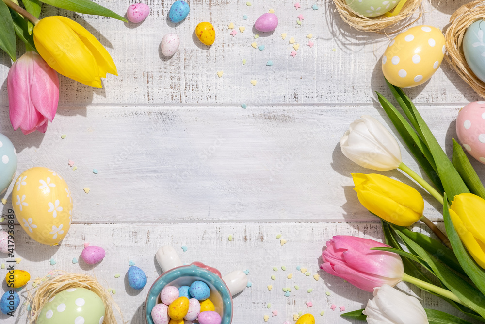 Happy easter background with bunnies, eggs, candies flowers - obrazy, fototapety, plakaty 