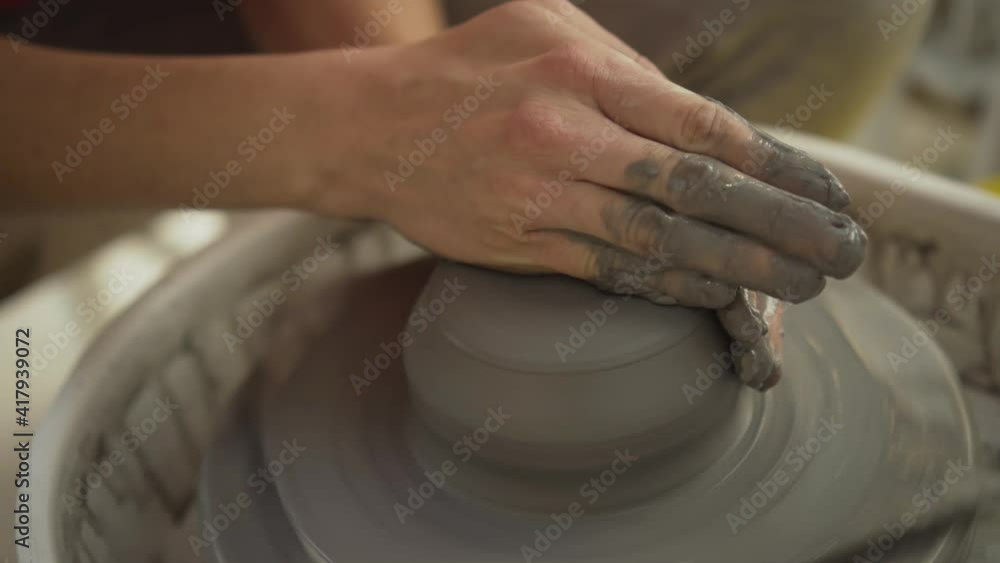 The manufacture of ceramics. Woman prepare clay for work on pottery