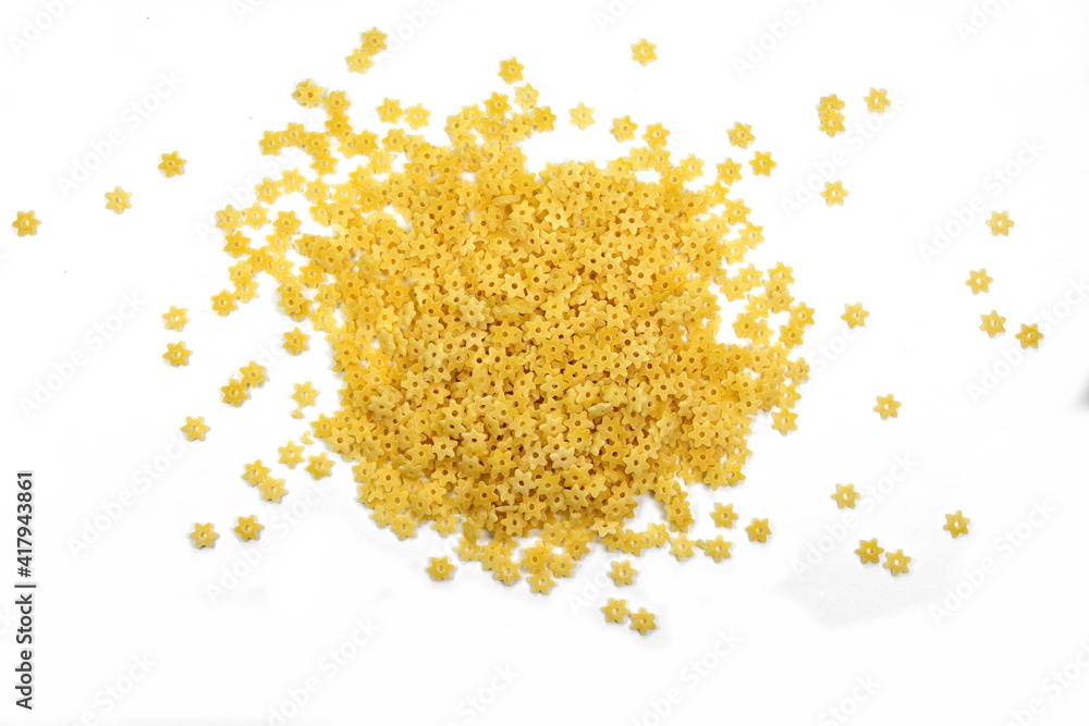 Pasta star shape isolated on white background. A portion of stars shaped pasta isolated on white. Pasta star shape isolated on white background. A portion of stars shaped pasta isolated on white.