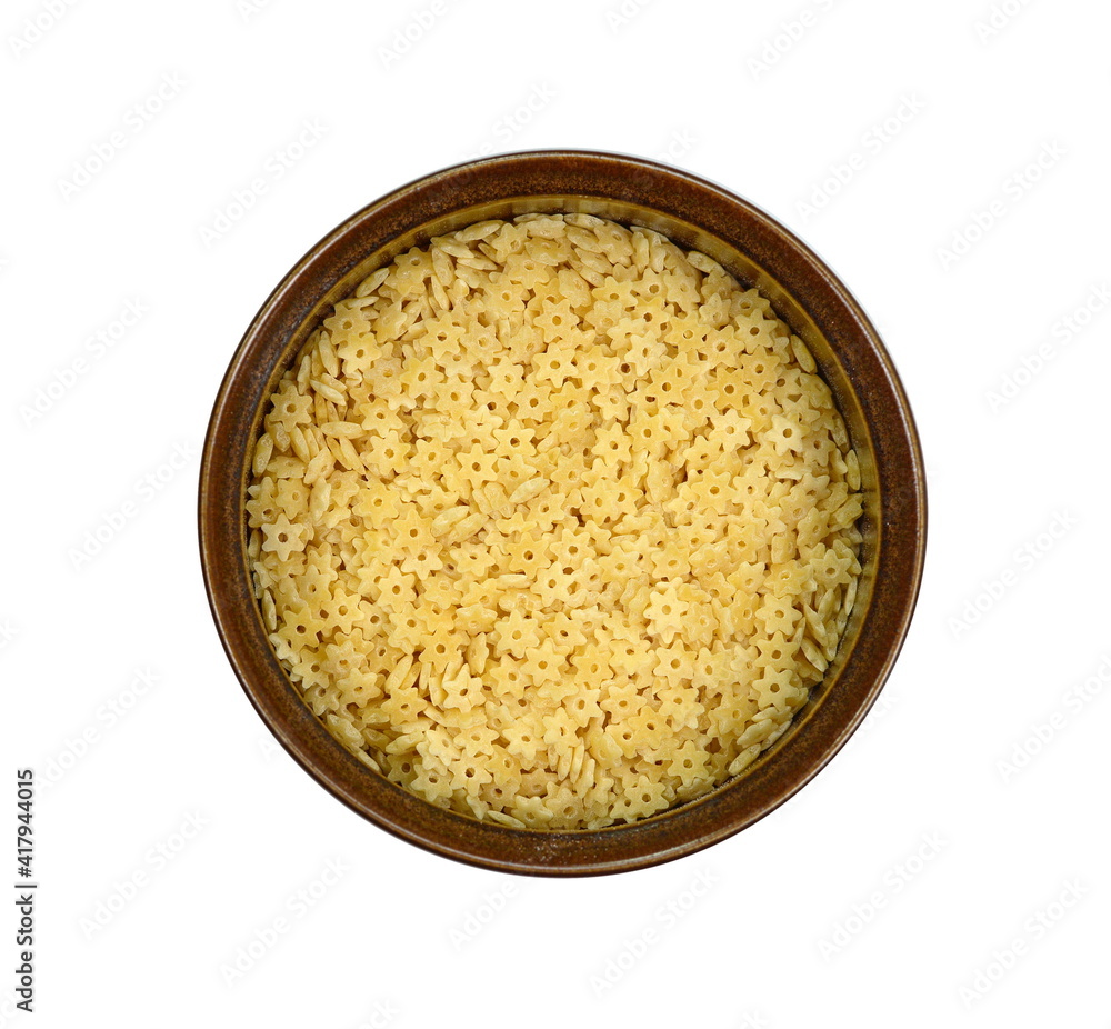 Pasta star shape in a bowl isolated on white background. A portion of stars shaped pasta isolated on white. Pasta star shape in a bowl isolated on white background. A portion of stars shaped pasta isolated on white.