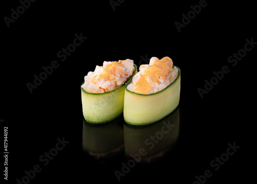 Gunkan maki sushi with shrimps, black background photo