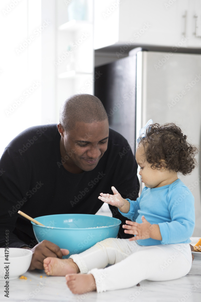 Dad and Daughter in a Modern Kitchen Dad and Daughter in a Modern Kitchen