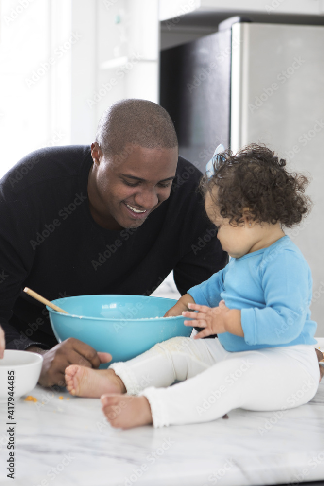 Dad and Daughter in a Modern Kitchen Dad and Daughter in a Modern Kitchen