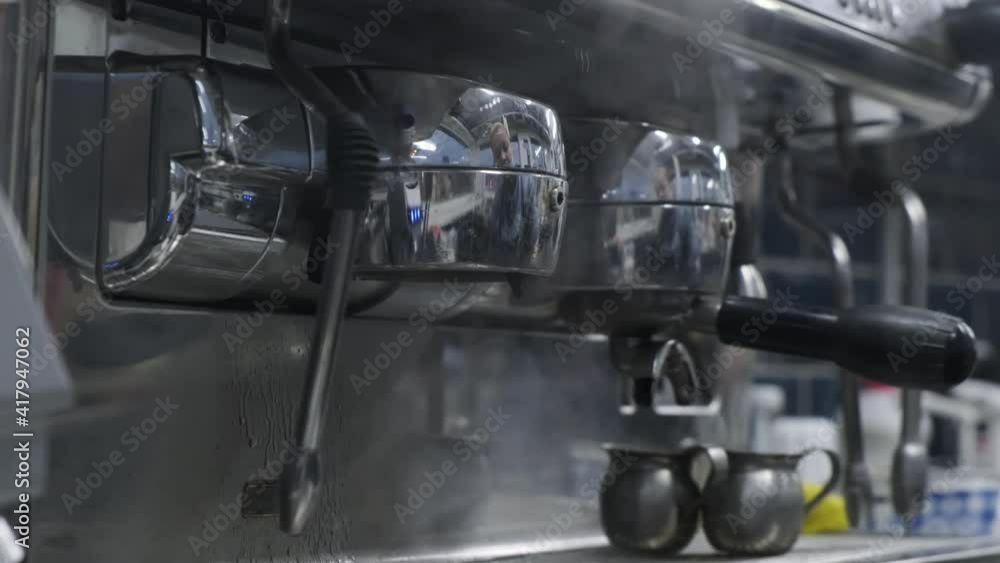Pouring coffee stream in cup 4k. Barista using espresso machine. Coffee bar and drink preparation Pouring coffee stream in cup 4k. Barista using espresso machine. Coffee bar and drink preparation