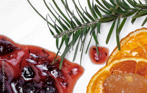 Making jam of black currant berry and honeysuckle berry with vintage jars on the table. Fresh berry on wooden table, summer still life and rustic food vintage background. Preserved fruits.
