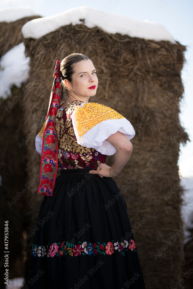 Young beautiful slovak woman in traditional dress. Slovak folklore Young beautiful slovak woman in traditional dress. Slovak folklore