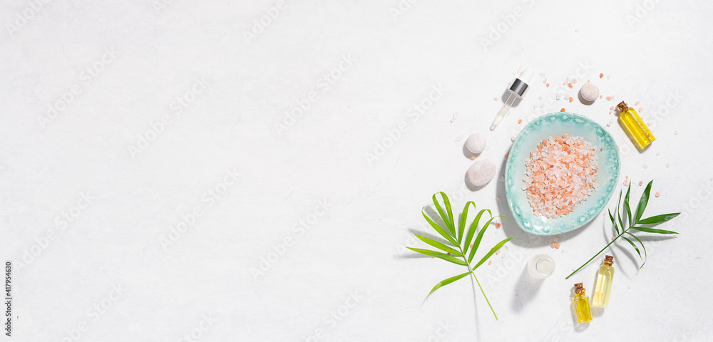 Spa and wellness banner with organic skin care products on white marble background. Body care concept, copy space for your design.