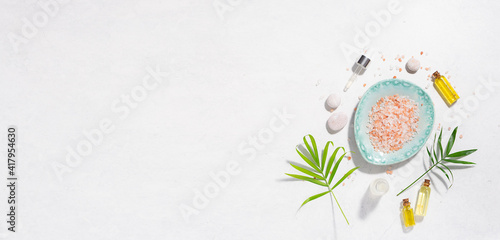 Spa and wellness banner with organic skin care products on white marble background. Body care concept, copy space for your design.