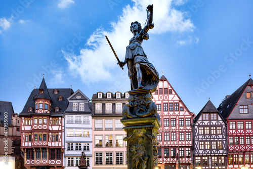 Justitia (Lady Justice) sculpture in front of the traditional buildings in Frankfurt am Main, Germany