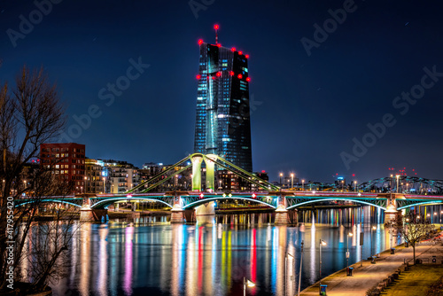 View to the Europäische Zentralbank (EZB ) at night with illuminated bridges in Frankfurt am Main, Germany photo