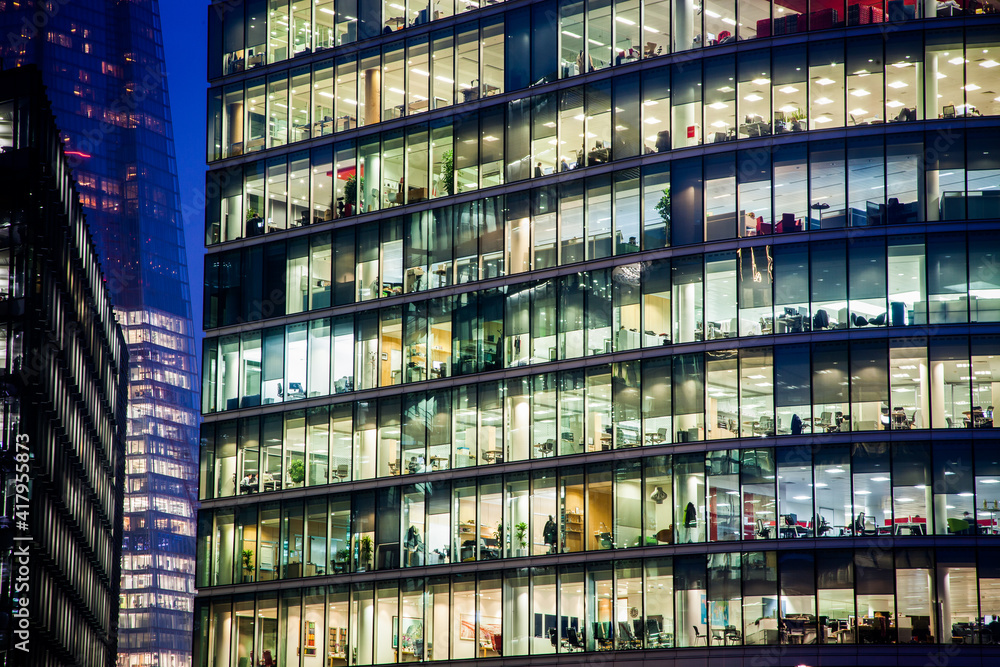 Obraz premium business office windows at night Corporate building London City England