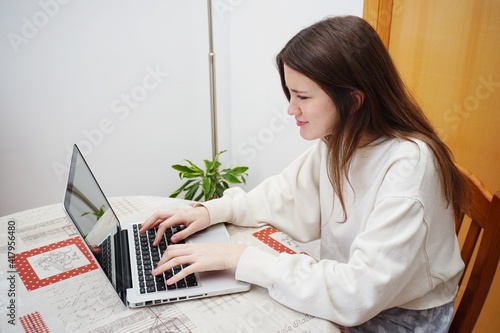 Teenager girl with computer and headphones