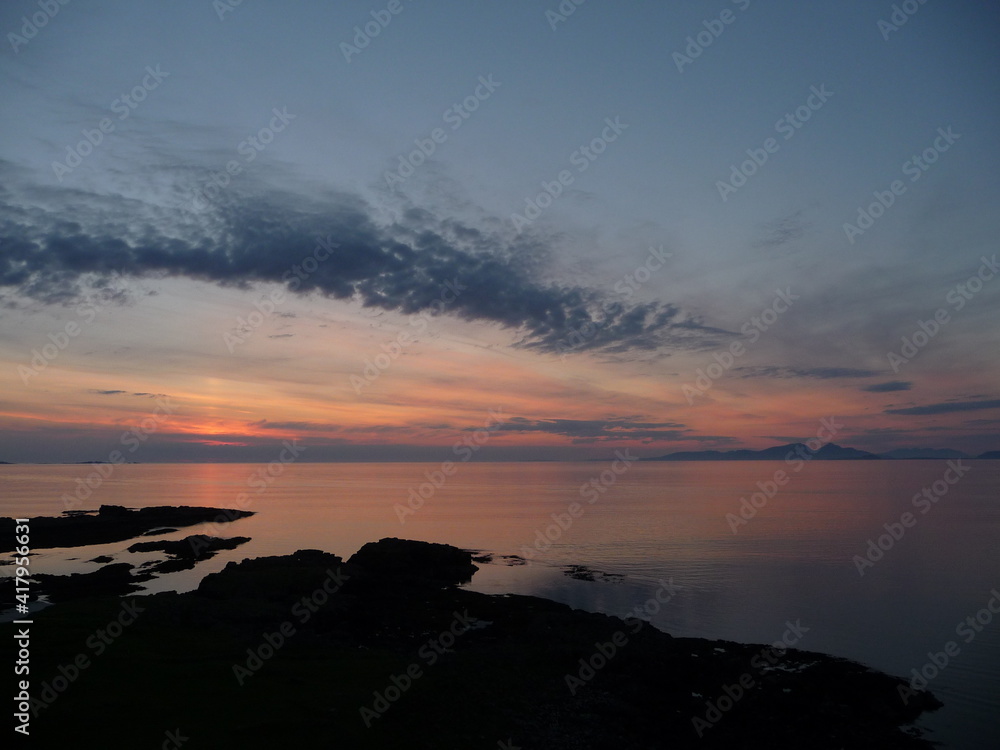 Twilight colours in the Western sky, looking over the sea towards the outer Hebridean islands, as seen from Croig, Isle of Mull on a summer's evening