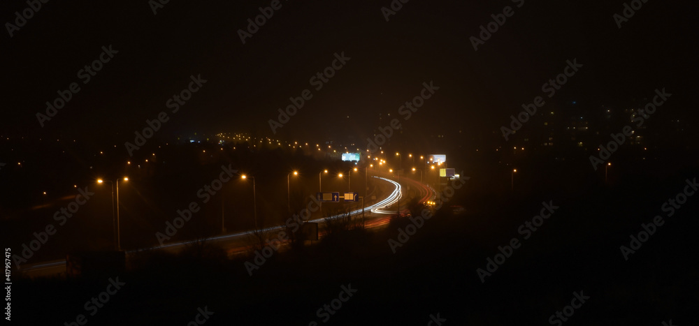 Night city, blurred traffic, light lines