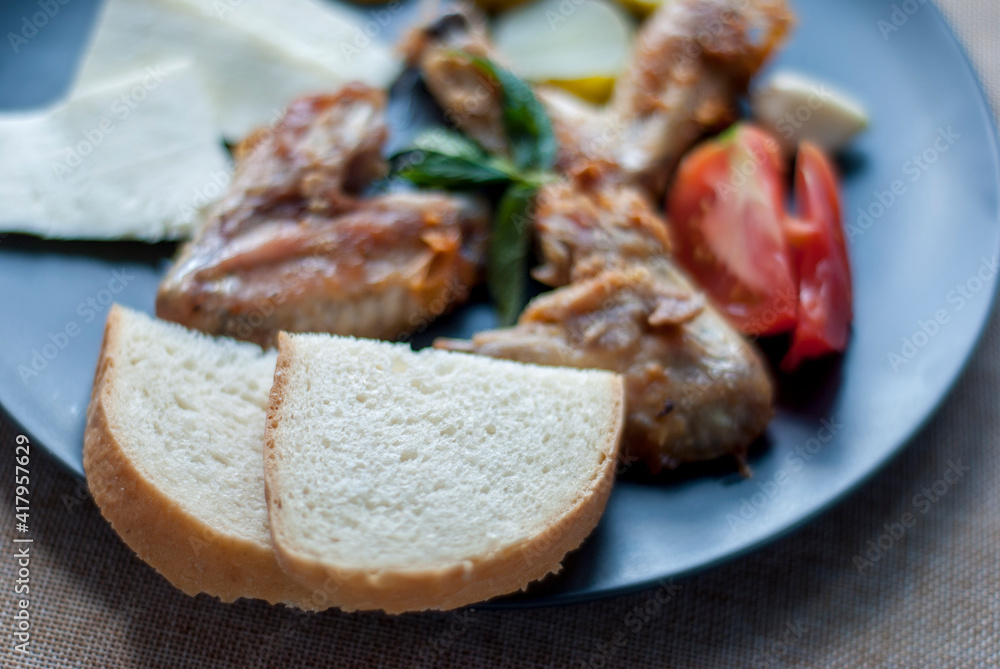 Sliced ​​bread meat and vegetables close-up.