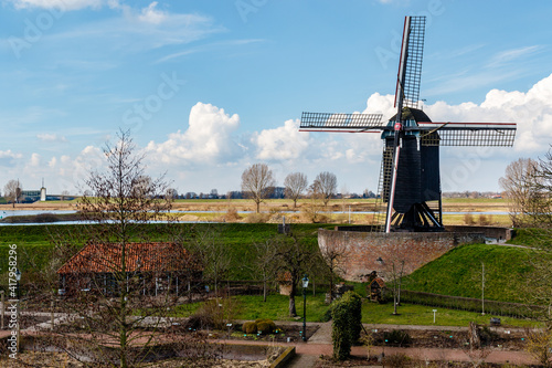 Windmill along the river Bergsche Maas in Heusden, Noord Brabant - The Netherlands - Europe photo