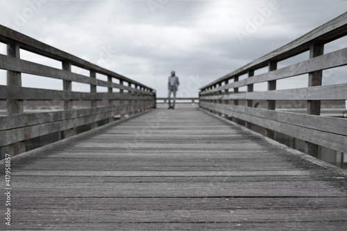 Gray wooden old bridge Symmetrical lines linear perspective