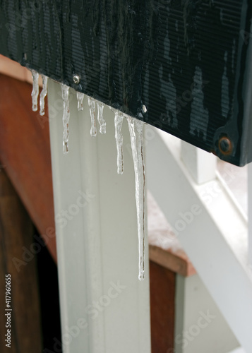 Icicles cling to a mailbox on a cold winter day