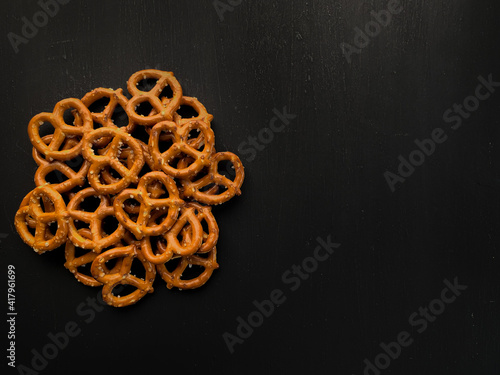 Pretzels on wooden black table