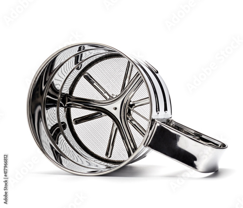 Φωτογραφία metal flour sifter on white background isolate