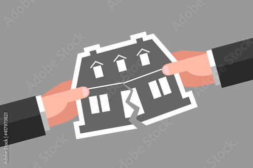 Two hands are tearing icon of house, concept of real estate division