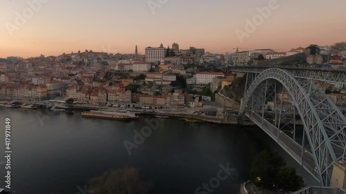 Beautiful golden timelapse of Porto at sunset, bridge, ribeira, monume photo