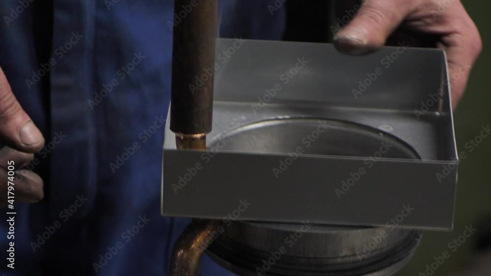 Welding of metal parts with spot welding. Work by hand without work gloves Welding of metal parts with spot welding. Work by hand without work gloves
