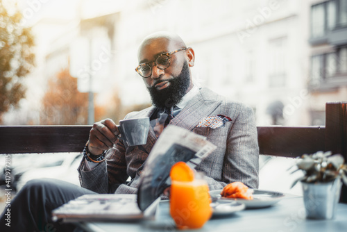 Quadro em tela Portrait of a baldheaded adult black dandy guy with a well-groomed beard, in a c