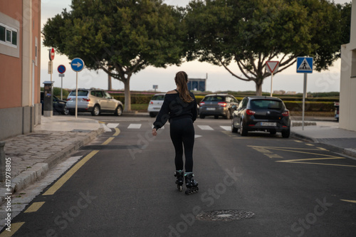 Wallpaper Mural Caucasian girl skating on roller skates on the promenade in Palma de Mallorca, Spain Torontodigital.ca