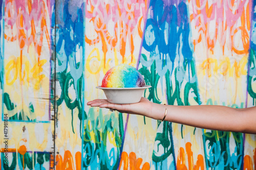 shave ice rainbow colors girl holding