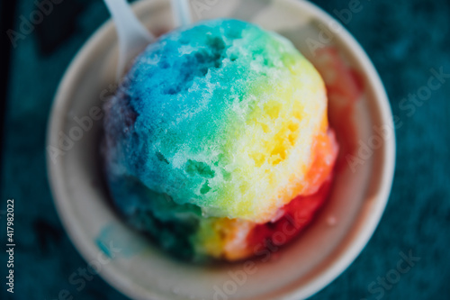 shave ice rainbow colors girl holding