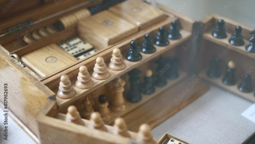 Close up of antique wooden chess and game set Close up of antique wooden chess and game set
