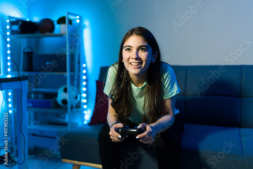 Caucasian woman gaming with a remote controller