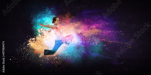 Male dancer against abstrac...