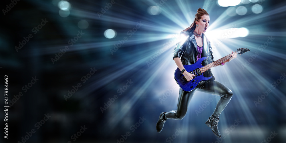 Young and beautiful rock girl playing the electric guitar Young and beautiful rock girl playing the electric guitar