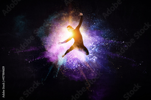 Male dancer against abstrac...