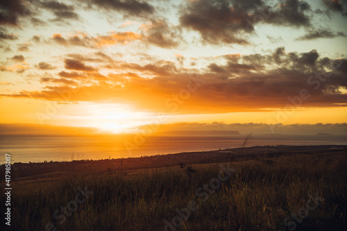 Fototapeta Naklejka Na Ścianę i Meble -  Sunset over the Westside of Kauai on a road trip