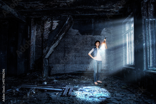 Young woman holding a flashlight