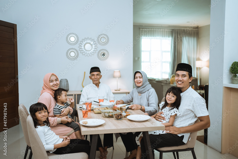 muslim asian family and grandparents having break fasting on ramadan. iftar dinner break muslim asian family and grandparents having break fasting on ramadan. iftar dinner break