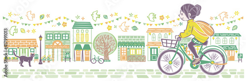 にぎやかな街並みで自転車に乗る女性